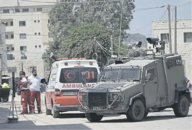  ?? ?? Israeli forces stop an ambulance during a military operation in the West Bank city of Jenin yesterday which saw hospitals blockaded