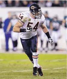  ?? AP FILE ?? Former Lovington High, UNM and Chicago Bears superstar Brian Urlacher was an NFL monster, but he took a physical beating as well.