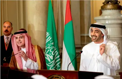  ?? AFP ?? UAE Minister of Foreign Affairs and Internatio­nal Cooperatio­n Sheikh Abdullah bin Zayed Al Nahyan talks to reporters as he stands next to Saudi Foreign Minister Adel Al Jubeir, during a press conference in Cairo on Wednesday. —