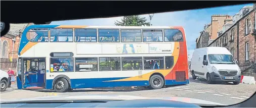  ??  ?? ROAD CHANGES: The bus at the at the junction of Haugh Road and Castle Road after the driver turned right against the new layout rules