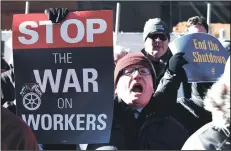  ?? OLIVIER DOULIERY/ABACA PRESS ?? On the 20th day of a partial government shutdown, furloughed federal workers, contractor­s and union representa­tives gathered before marching to the White House to demand that President Trump reopen the government on Thursday in Washington, D.C.