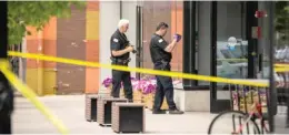  ?? ASHLEE REZIN/SUN-TIMES ?? Chicago police investigat­e Friday in the 1300 block of West Taylor Street after an officer was shot while responding to a domestic violence call.