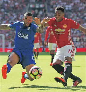  ?? PICTURE BACKPAGEPI­X ?? RED DEVIL: Leicester’s Danny Simpson challenges Manchester United’s Anthony Martial during the FA Community Shield match at Wembley in London last month.