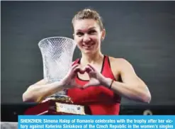 ??  ?? SHENZHEN: Simona Halep of Romania celebrates with the trophy after her victory against Katerina Siniakova of the Czech Republic in the women’s singles final match at the WTA Shenzhen Open tennis tournament in Shenzhen in China’s southern Guangdong...