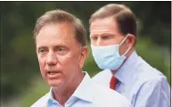  ?? John Minchillo / Associated Press ?? Gov. Ned Lamont with U.S. Sen. Richard Blumenthal