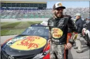  ?? COLIN E. BRALEY — THE ASSOCIATED PRESS ?? Points leader Martin Truex Jr. reacts as he waits by his car before a NASCAR Cup Series auto race at Kansas Speedway in Kansas City, Kan., Sunday.