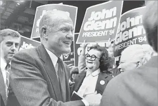  ?? Elise Amendola Associated Press ?? ‘NEVER REALLY A COALITION BUILDER’ Glenn, campaignin­g early for the 1984 Democratic presidenti­al nomination, greets supporters in Massachuse­tts in 1983. He racked up $3 million in debt and didn’t make it out of the primaries.