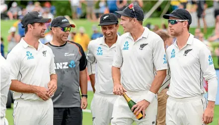  ??  ?? The Black Caps reflect on a job well done after crushing Sri Lanka by 423 runs in the second test in Christchur­ch.