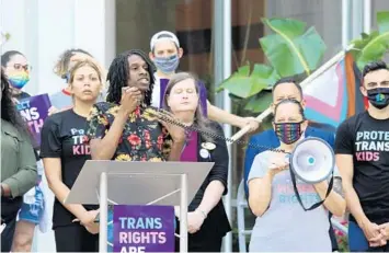  ?? KATIE RICE/ORLANDO SENTINEL ?? Angel Nelson, senior program manager of The Bros in Convo initiative, speaks out against legislatio­n banning transgende­r girls and women from competing in women’s sports during the #ProtectTra­nsKids rally June 1.