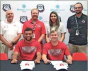  ?? Gail Conner ?? Cedartown’s Kam Palacios (seated, left) and Sam Arnold are joined by Gadsden State men’s tennis coach Buster Stewart (standing, from left), and Cedartown tennis coaches Matt Foster, Vanessa Flores, and Matt Bentley during a ceremony at Cedartown High School on Tuesday, May 16.