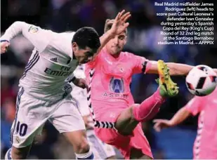  ??  ?? Real Madrid midfielder James Rodriguez (left) heads to score past Cultural Leonesa’s defender Ivan Gonzalez during yesterday’s Spanish Copa del Rey (King’s Cup) Round of 32 2nd leg match at the Santiago Bernabeu stadium in Madrid. – AFPPIX