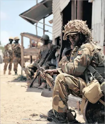  ??  ?? A Ugandan soldier, belonging to the African Union Mission in Somalia. The EU’s decision to reduce funding for the AU Mission in Somalia was against Britain’s wishes, according to James Duddridge, a former British minister for Africa and a Brexit...