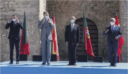  ?? Photo PA ?? PM Pedro Sánchez and King Felipe VI stand alongside Portugal's President Marcelo Rebelo de Sousa and Portugal's PM Antonio Costa at the border opening ceremony in Elvas, Portugal.