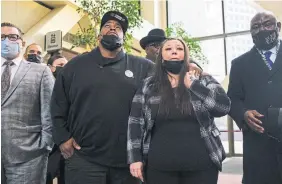  ?? STEPHEN
M AT U R E N GETTY IMAGES ?? Daunte Wright’s parents Aubrey and Katie Wright, centre, react after the sentencing hearing for former police officer Kim Potter, who fatally shot their son during a traffic stop.