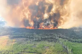  ?? FILE ?? The Bald Mountain Wildfire is shown in the Grande Prairie Forest Area on May 12 in this handout image provided by the government of Alberta.