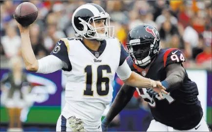  ?? Alex Gallardo ?? The Associated Press Rams quarterbac­k Jared Goff passes under pressure from Texans linebacker Ufomba Kamalu in Los Angeles’ 33-7 home victory on Sunday. A CG Technology bettor won $400,000 betting on the Rams — a $220,000 wager at minus-12½ points and...