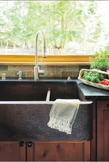  ??  ?? Deep, farmhouse-style trough sinks continue to be popular, but new hues and materials will personaliz­e spaces.