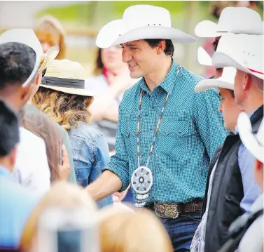  ?? AL CHAREST / POSTMEDIA ?? Prime Minister Justin Trudeau was adored at the Calgary Stampede on the weekend, but couldn’t avoid negative comments about the Omar Khadr settlement, which he has turned into a public relations mess, Don Braid writes.