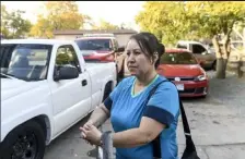  ?? AARON ONTIVEROZ / The Denver Post ?? Maria Ceballos said her son’s car was towed last week at Berkeley Village Mobile Home Park because the required permit sticker was on the dashboard and had not been put on yet. She said towing companies have been unfairly targeting residents for parking violations.