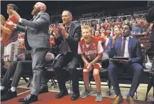  ?? Santiago Mejia / The Chronicle ?? Ty Whisler, 11, sits on the Stanford bench Thursday, cheering the team on to a solid victory over the Washington Huskies.