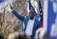  ?? BEN GRAY - ASSOCIATED PRESS ?? Democratic U.S. Senate challenger, the Rev. Raphael Warnock, waves during a rally Dec. 21, in Columbus, Ga.