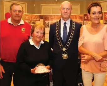  ??  ?? Olive Morgan is presented with a prize pack. Pictured are Vice Captain Pat McCabe, Olive Morgan, Mayor Pio Smith and Maureen Ward of the Homeless Aid. Right: Val Smyth and John Kinsella are presented with prizes at the Homeless Aid event in the Baltray...