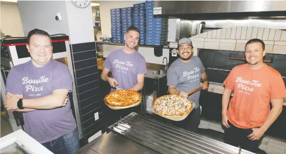  ?? PHOTOS: BRENDAN MILLER ?? Serving up classic comfort: Bow Tie Pizza’s co-owner Dustin Blaine, left, co-owner Paul Hebert, kitchen manager Jesus Dichi Romero, and co-owner Yanie Kosmas.