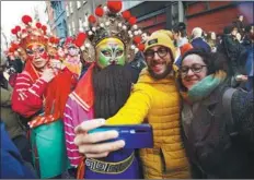  ?? YU GUO / FOR CHINA DAILY; TO CHINA DAILY ?? From left: A performer from Nanshan Yingge dance team and employees at Burlington Arcade pose in London. Chinese New Year parade in London. A Yingge dancer draws a big crowd.PROVIDED