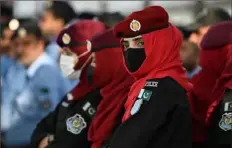  ?? Aamir Qureshi/AFP via Getty Images ?? Security personnel stand guard Saturday outside the Parliament House building in Islamabad. Pakistani Prime Minister Imran Khan said he accepted a supreme court ruling that will lead to his ouster from office.