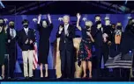  ??  ?? WILMINGTON, Delaware: US President-elect Joe Biden (center) with his wife Jill Biden and members of their family salute the crowd on stage after delivering remarks in Wilmington, Delaware in this November 7, 2020 file photo.