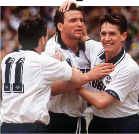  ??  ?? Cup hero: Stewart (centre) is congratula­ted by team-mates Paul Allen and Gary Lineker after scoring in the 1991 FA Cup Final