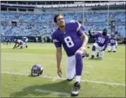  ?? BOB LEVERONE — THE ASSOCIATED PRESS FILE ?? Vikings’ Sam Bradford (8) stretches before a game against the Panthers in Charlotte, N.C.