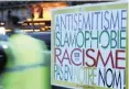  ?? FRANCOIS MORI AP ANA ?? A POSTER reads: “Anti-Semitism, Islamophob­ia, Racism, Not in Our Name” during a gathering decrying anti-Semitism at Place de la Republique in Paris. |