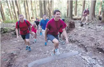  ?? — THE CANADIAN PRESS FILES ?? Justin Trudeau climbs the Grouse Grind during the 2015 federal election campaign.