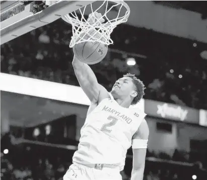 ?? JULIO CORTEZ/AP ?? Maryland guard Aaron Wiggins dunks against Oakland in the second half Saturday in College Park.