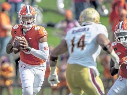  ?? Josh Morgan, USA Today Network ?? Clemson quarterbac­k D. J. Uiagalelei passes the ball against Boston College on Saturday. Uiagalelei stepped in for Trevor Lawrence and rallied the top- ranked Tigers to a 34- 28 victory over Boston College.
