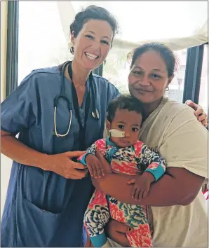  ??  ?? Physio Gaelle Smith with patient Peato and his mum in the Samoa hospital fighting a measles epidemic