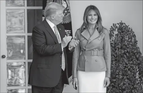  ?? ANDREW HARNIK/AP PHOTO ?? President Donald Trump and first lady Melania Trump stand together following Melania’s “Be Best” event in the Rose Garden of the White House Monday in Washington. Sixteen months into the president’s term, Melania Trump unveiled plans for her...