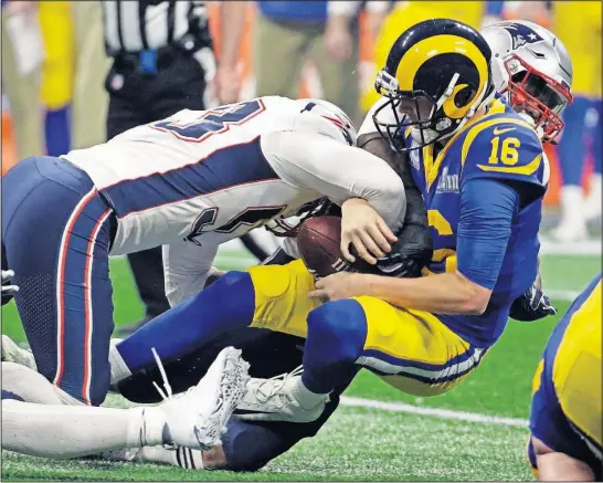  ?? [MARK HUMPHREY/THE ASSOCIATED PRESS] ?? The Patriots’ Kyle Van Noy sacks the Rams’ Jared Goff in the second half of the Super Bowl on Sunday. New England held Los Angeles to 260 yards.