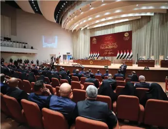  ?? EPA ?? Iraqi MPs attend a parliament­ary session in March. Prime Minister Mustafa Al Kadhimi’s caretaker government submitted the first draft of the bill to meet demands for cash two months ago