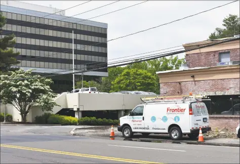  ?? Alexander Soule / Hearst Connecticu­t Media ?? A Frontier Communicat­ions van near the Merritt 7 Corporate Park in Norwalk, where Frontier has its corporate headquarte­rs. Frontier reported a $517 million loss in 2017 on its Connecticu­t operations, largely the result of a write-down in the “goodwill” inherent in the assets it acquired from AT&T in October 2014.