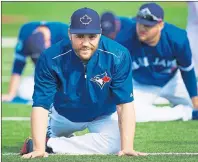  ?? CP PHOTO ?? Toronto Blue Jays catcher Russell Martin stretches during baseball spring training in Dunedin, Fla. on Wednesday.