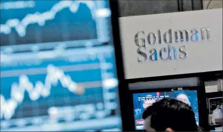  ?? AP FILE PHOTO ?? The plunge in the price of oil contribute­d to a 7 percent decline in quarterly profit at Goldman Sachs.