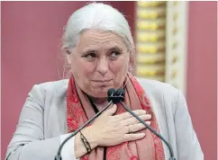  ?? JACQUES BOISSINOT / THE CANADIAN PRESS ?? Québec solidaire co-leader Manon Massé puts her hand to her heart to thank former QS MNAs after she was sworn in to the National Assembly on Wednesday.
