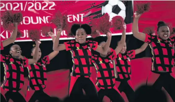  ?? > Photos: Samuel Shivambu/BackpagePi­x ?? The TS Galaxy cheerleade­rs show off the new home strip.