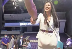  ??  ?? Students and faculty of Grand Canyon University congratula­te Jamie Boggs on Monday at Grand Canyon University Arena.