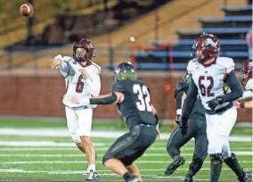  ?? ?? Blanchard’s Carson Cooksey, left, passes the ball during the 4A state championsh­ip game against Wagoner.