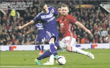  ??  ?? Manchester United’s Luke Shaw attempts to shoot at goal. — Reuters photo