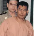  ?? APICHIT JINAKUL ?? Pol Sgt Prasart Jantima is escorted to hear the Supreme Court ruling. The court dismissed his self-defence claim and upheld a twenty-year jail term for killing a soldier in March 2008.