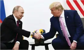  ??  ?? Trump with Putin in Osaka in June last year. Trump has continued his obsequious behavior towards the Russian president. Photograph: Brendan Smialowski/AFP via Getty Images